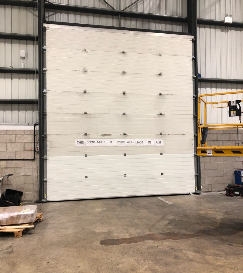 Sectional High Rise Door has been impacted -7